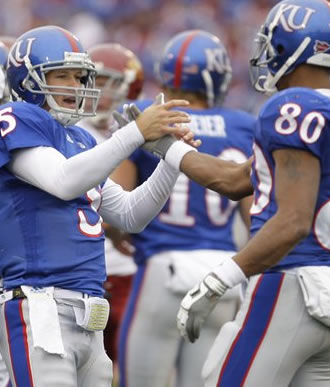 Reesing celebrates with Dezmon Briscoe after a TD